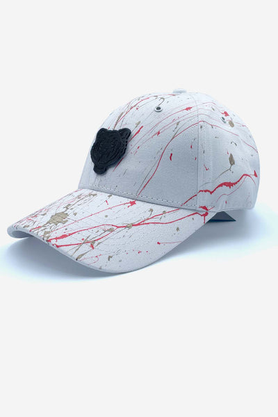 White cap with red and gold paint