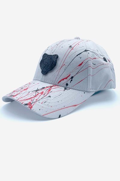 White cap with red and black paint